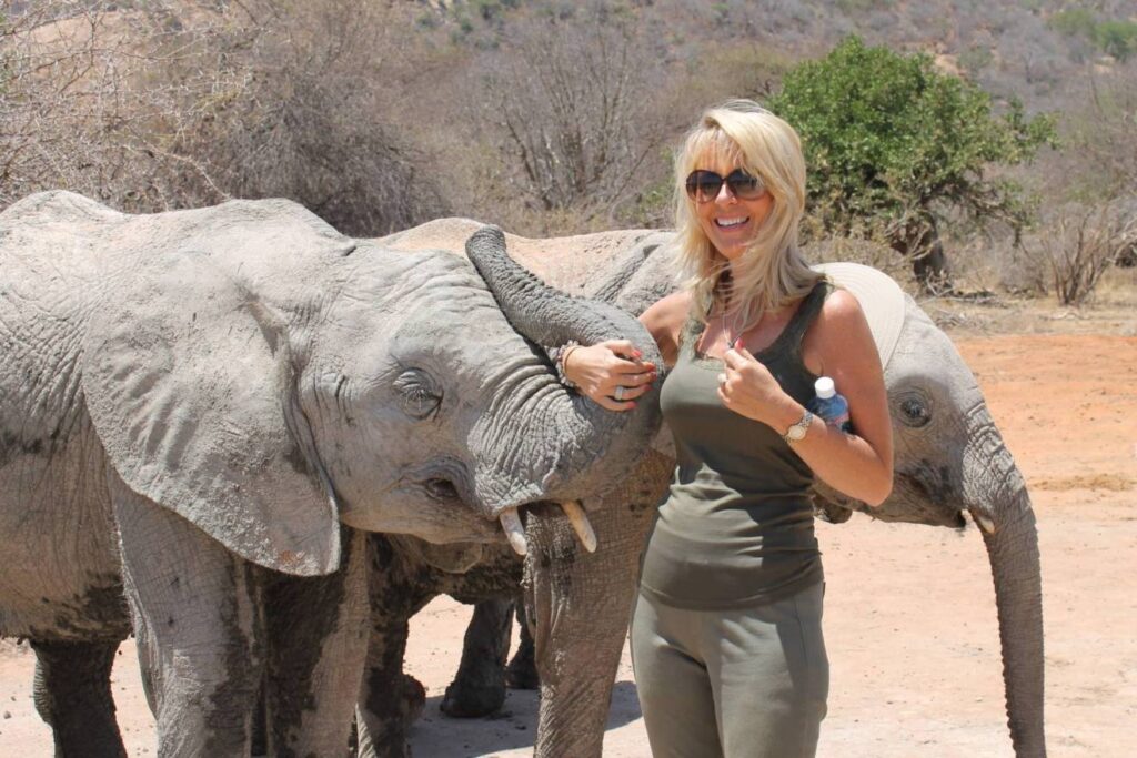 Orphan Trail Safaris - Beverly Perry with elephants