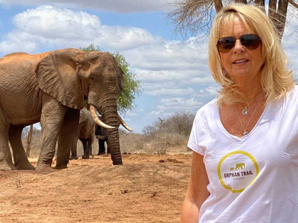 Orphan Trail Safaris - Beverly and with Elephant in the background